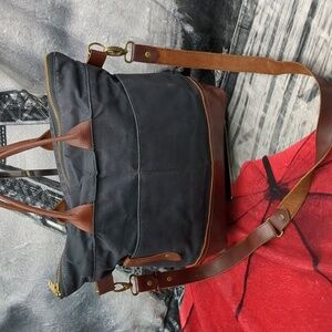 R. Riveter signature Black canvas. Brown leather bag